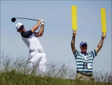  ?? CHARLIE RIEDEL — THE ASSOCIATED PRESS ?? Paul Casey hits from the fifth tee during the second round of the U.S. Open on Friday. Casey is one of four golfers tied for the lead.