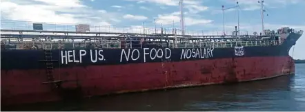  ?? — Photo courtesy of NUSPM ?? In dire straits: A cry for help written by the ‘MV Viet Tin 01’ crew members on the hull of the Vietnamese vessel in Teluk Rumania, Johor.