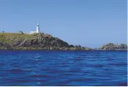  ??  ?? BELOW: Round Island lighthouse is a good daymark for northabout arrivals LEFT: Mullion Cove, west of the Lizard