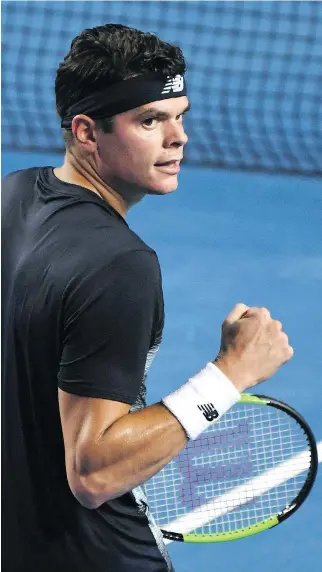  ?? GREG WOOD/AFP/GETTY IMAGES ?? Milos Raonic celebrates beating Roberto Bautista Agut in their fourth-round Australian Open match on Monday in Melbourne, Australia. Raonic will next face Rafael Nadal in the quarter-finals.