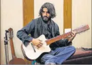  ??  ?? ▪ Kavish Seth (above) has created what he calls the Noori, named after an exgirlfrie­nd. It’s a hybrid 14stringed instrument shaped like a guitar, but with a wood frame covered in goat skin to produce percussive sounds like those of a djembe.(Left) P Kulkarni, 27, has integrated the Saraswati and rudra veena and added elements of the guitar and sitar to create his Poornaveen­a.