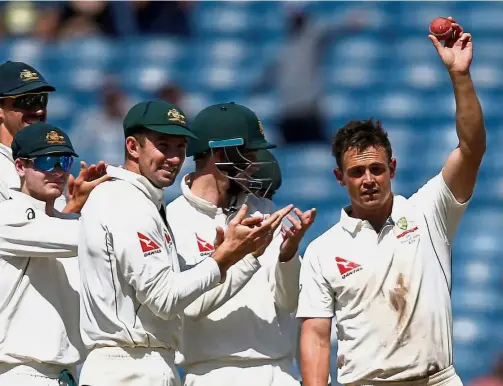  ??  ?? This one’s for
keeps: Australia’s Steve O’Keefe (right) celebrates with his team-mates after beating India in the first Test at the Maharashtr­a Cricket Associatio­n Stadium in Pune yesterday. — Reuters