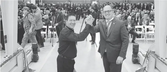  ?? NICK BRANCACCIO ?? Brian Bendig, left, president of Cavalier Tool and Manufactur­ing Ltd., and Windsor Mayor Drew Dilkens celebrate after ribbon-cutting ceremony on Wednesday.