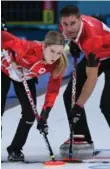  ?? WANG ZHAO/AFP/GETTY IMAGES ?? Canada’s Kaitlyn Lawes and John Morris competed in curling mixed doubles, a new event for 2018.