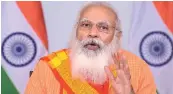  ?? PTI ?? PM Narendra Modi interacts with doctors and frontline workers on Covid-19 situation in Varanasi, through video conferenci­ng, in Delhi on Friday. —