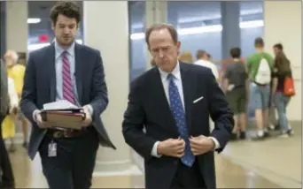  ?? J. SCOTT APPLEWHITE — THE ASSOCIATED PRESS ?? Sen. Pat Toomey, R-Pa., heads to a caucus meeting with the leadership struggling with senators who are opposed or wavering on the Republican health care bill, at the Capitol in Washington on Tuesday.