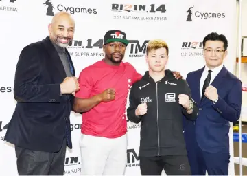  ?? — AFP photo ?? (From left) Managing Partner and CEO of ONE Entertainm­ent Brent A Johnson, Mayweather, Nasukawa and RIZIN Fighting Federation president Nobuyuki Sakakibara pose during a news conference at the Mayweather Boxing Club in Las Vegas, Nevada.