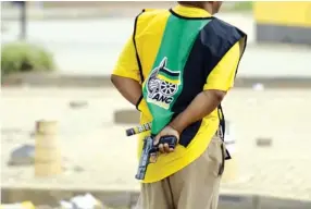  ?? Picture: Alaister Russell. ?? CROSSING THE LINE. This man, identified by one newspaper as a former ANC councillor and local party leader, is the subject of an uproar after he drew a gun in Bekkersdal when residents began protesting against an ANC election campaign in the area.