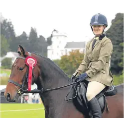  ?? Picture: Jim Crichton. ?? Auchtermuc­hty rider Jennifer MacGregor and novice winner Jack Daniels IX.