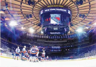  ?? BRUCE BENNETT/POOL PHOTO VIA AP ?? The New York Islanders, shown celebratin­g a victory over the host New York Rangers on Thursday, have had to endure a condensed schedule.