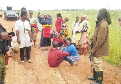  ?? Photo: DHQ ?? Some of the 23 kidnapped victims rescued by troops of Operation SAHEL SANITY from bandits along Zauni- Jengebe road in Gusau L.G.A of Zamfara State. The victims were kidnapped while on transit to Magami Market from Gusau in a passenger bus