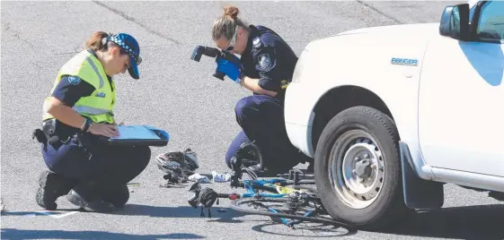  ?? Picture: SCOTT POWICK/DAILY NEWS ?? A bike lies under the wheels of a ute after a collision at Coolangatt­a which left a cyclist in a a critical condition.
