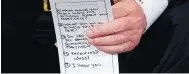  ?? CAROLYN KASTER / THE ASSOCIATED PRESS ?? U.S. President Donald Trump holds notes during a “listening session” on gun violence at the White House on Wednesday.