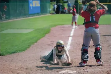  ?? ERIC BONZAR—THE MORNING JOURNAL ?? Perrysburg’s Marissa Thomas slide into home plate in the bottom of the 10th inning, giving the Yellow Jackets a 1-0in over the defending Division I champion Elyria Pioneers on May 23.