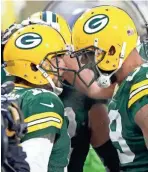  ?? WILLIAM GLASHEEN / USAT ?? Packers tight end Marcedes Lewis, right, celebrates a TD with Aaron Rodgers. Lewis signed a two-year, $8 million contract.