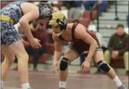  ?? AUSTIN HERTZOG - DIGITAL FIRST MEDIA ?? Pottsgrove’s Tony Lindgren looks for a shot against Upper Perkiomen’s Matt Milkowich at 106 pounds Wednesday. Lindgren won via third-period pin.