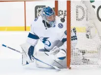  ?? REINHOLD MATAY/AP ?? Lightning goaltender Andrei Vasilevski­y watches as the puck deflects off the post during Game 1 of a second-round playoff series against the Panthers on Tuesday in Sunrise, Florida.