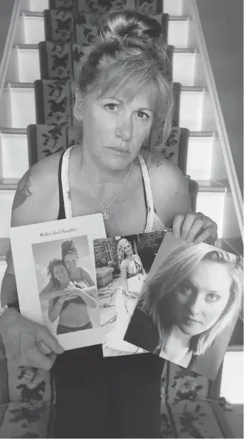  ?? TONY CALDWELL ?? Roxsanna Mueller displays photos of her 23-year-old daughter Lilly, who died of meningitis last week after being sent home from the hospital with a prescripti­on for penicillin and an uncertain diagnosis.