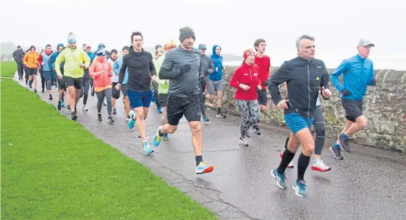  ?? ?? AND THEY’RE OFF: Participan­ts at Arbroath’s West Links parkrun set a brisk pace as they set off at the start of the popular Saturday morning event.