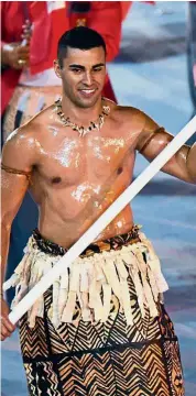  ?? — AFP ?? One of a kind: Tonga’s flag-bearer Pita Taufatofua leads his delegation during the opening ceremony of the Rio 2016 Olympic Games at the Maracana Stadium in Rio de Janeiro.