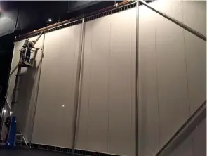  ?? Photo courtesy TRAHC ?? ■ Operations director Randal Conry cleans 25 years of dust from the Perot Theatre’s movie screen.