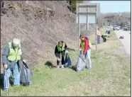  ??  ?? Volunteers pick up garbage alongside Bella Vista Way — or U.S. 71 — during March 20’s Six in Sixty highway cleanup event. (NWA Democrat-Gazette/Keith Bryant)