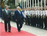  ?? (Haim Zach/GPO) ?? PRESIDENT REUVEN RIVLIN reviews the troops alongside Ukrainian President Petro Poroshenko in Kiev yesterday.