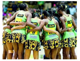  ?? MULTIMEDIA PHOTO EDITOR GLADSTONE TAYLOR/ ?? Members of Jamaica’s national senior women’s netball team, the Sunshine Girls, huddle during a match against England in the Sunshine Series last year at the National Indoor Sports Centre.