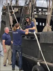  ??  ?? Crew members secure a replica of the Nina to a dock on Wednesday in Biloxi, Miss.