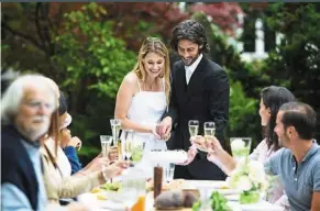  ?? — adrian raba/westend61/dpa ?? a big question that engaged couples need to think about early on is what everyone eats on the big day. It helps to know the pros and cons of a buffet.