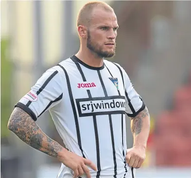  ?? Picture: SNS. ?? Kallum Higginboth­am wants to make sure Dunfermlin­e’s youngsters do not run into the same difficulty which saw his own career temporaril­y stall after a move to England.