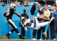  ?? AP PHOTO ?? Carolina Panthers’ Josh Norman, right, intercepts a pass in front of New Orleans Saints’ Brandin Cooks.