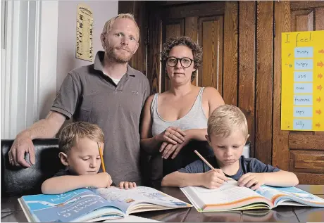  ?? PETER LEE WATERLOO REGION RECORD ?? Jorg and Katharina Broschek with their children Phil, 3, left, and Len, 6, who is about to enter the French immersion program at Suddaby. The parents are worried inequaliti­es may be amplified by the elective program at their son’s school.