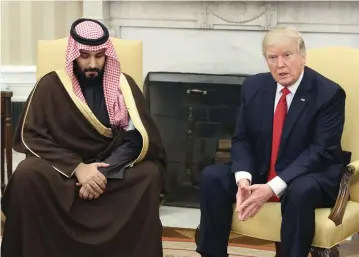  ?? (Mark Wilson/Pool/TNS) ?? US PRESIDENT DONALD TRUMP meets with Saudi Deputy Crown Prince and Defense Minister Mohammed bin Salman in March at the White House.