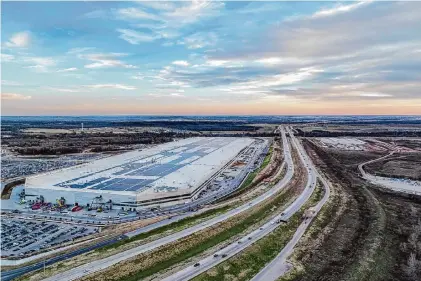  ?? Brandon Bell/Getty Images ?? An aerial view of Tesla’s headquarte­rs in Travis County. The released factory property still will be subject to state and county regulation­s, which are generally less strict than what a city can impose.