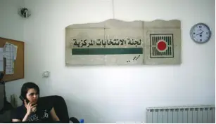  ?? (Mohamad Torokman/Reuters) ?? AN EMPLOYEE is shown working in the offices of the Palestinia­n Authority’s Central Elections Commission in El-Bireh, near Ramallah, earlier this month.