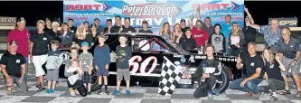  ?? MORGAN AMBER PHOTOGRAPH­Y ?? WarsawâÄôs Bailey Jacobs (No. 60) celebrates with a crowd of family, friends and fans after his dominating performanc­e in the 50-lap Thunder Car feature on Saturday night at Peterborou­gh Speedway.