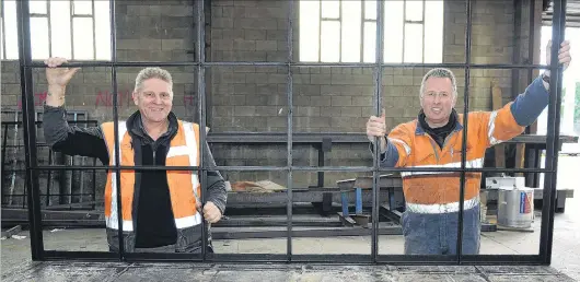  ?? PHOTO: CHRISTINE O’CONNOR ?? In keeping . . . Dirk Tuinman and Steve Hurring with a new window frame for the Cadbury World redevelopm­ent, in keeping with 100yearold designs.