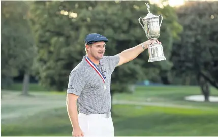  ?? Bryson DeChambeau celebrates with the trophy after winning the US Open at Winged Foot on Sunday. AFP ??