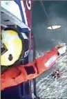  ?? THE ASSOCIATED PRESS ?? An image from video issued by the Maritime & Coastguard Agency Tuesday, shows the rescue of a Scottish surfer.