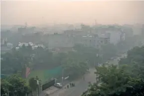  ?? AP PHOTO/ALTAF QADRI ?? Morning haze and smog envelops the skyline in New Delhi, India, on Nov. 5.