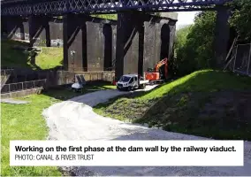  ?? PHOTO: CANAL & RIVER TRUST ?? Working on the first phase at the dam wall by the railway viaduct.