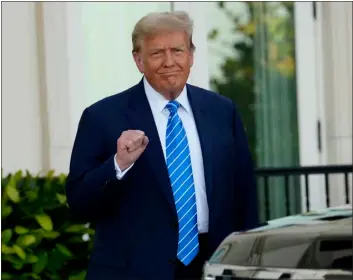  ?? LYNNE SLADKY — THE ASSOCIATED PRESS ?? Former President Donald Trump pumps his fist as he arrives for a GOP fundraiser Saturday in Palm Beach, Fla.
