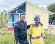  ?? AINSWORTH MORRIS ?? National sprinter Yohan Blake (left) and Irene Morgan standing before her new house recently. Blake financed the constructi­on as Morgan’s Mother’s Day gift.
