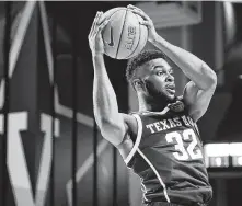  ?? Mark Humphrey / Associated Press ?? Texas A&M forward Josh Nebo was not highly recruited in high school but has blossomed in his senior year with the Aggies.