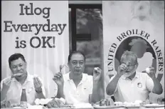  ?? MICHAEL VARCAS ?? Broiler raisers eat chicken and eggs during a press conference in Quezon City yesterday to show that not all poultry products in the country are affected by avian flu.