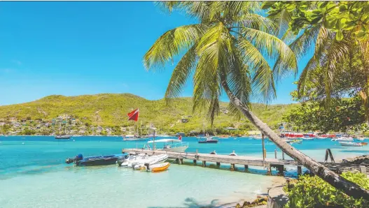  ?? PHOTOS: GETTY IMAGES ?? Bequia is so remote that water must be collected from rain or brought in from nearby islands on boats, preventing mass tourism to this quiet getaway.