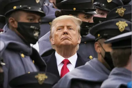  ?? ANDREW HARNIK — THE ASSOCIATED PRESS ?? Surrounded by Army cadets, President Donald Trump watches the first half of the 121st Army-Navy Football Game in Michie Stadium at the United States Military Academy, Saturday, Dec. 12, 2020, in West Point, N.Y.