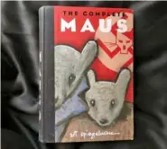  ?? Europe. STAFF PHOTO BY KIM SEBRING ?? “The Complete Maus,” a novel by Art Spiegelman, tells the story of Vladek Spiegelman’s experience of surviving in Hitler’s