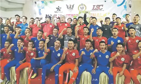  ??  ?? Awang Tengah (standing back row, eighth from right) cheer with the President Cup squad and officials.